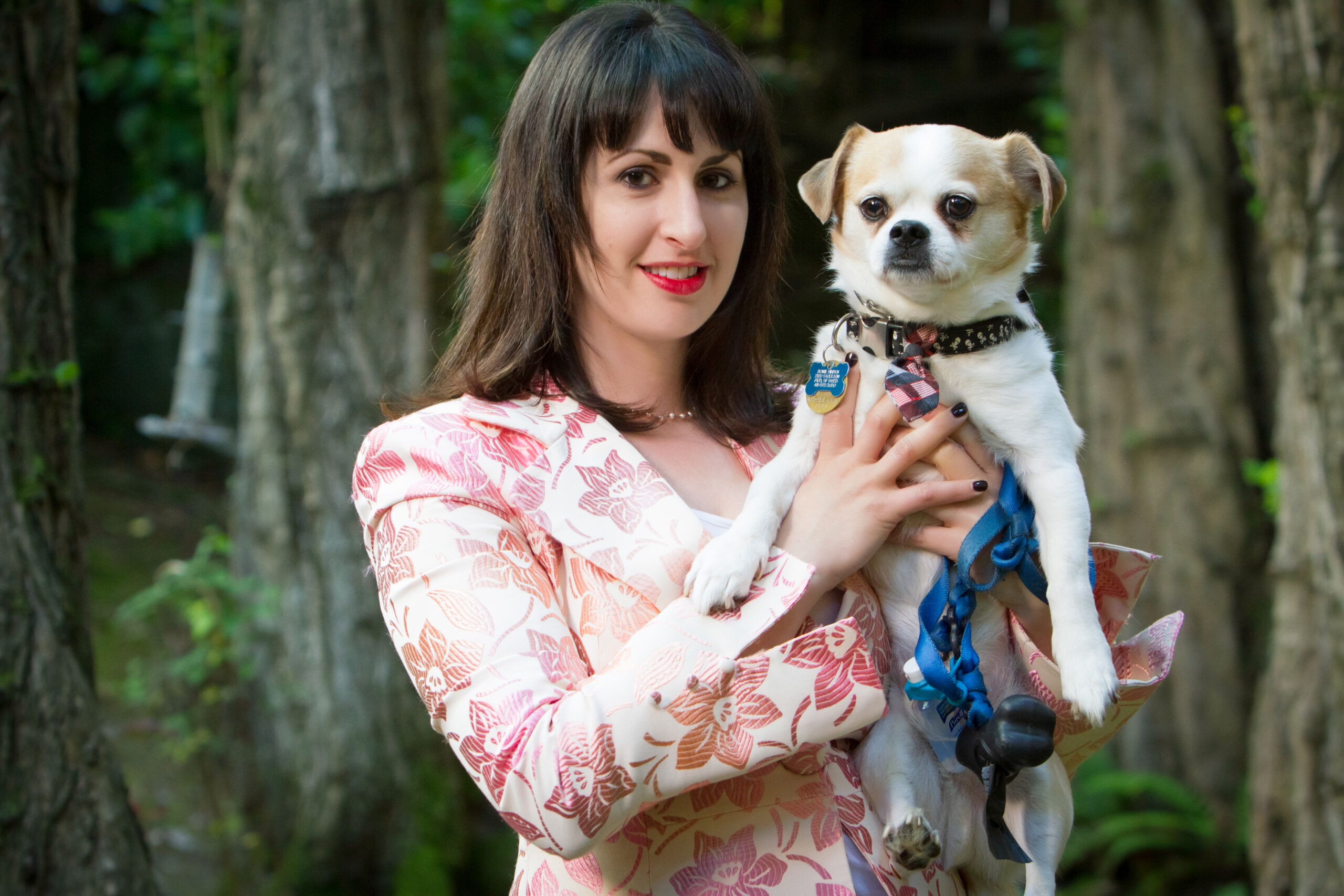 Photo of Traci holding a dog